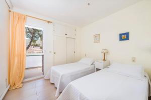 Postel nebo postele na pokoji v ubytování Apartamento playa de los pinos