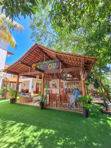 a gazebo with a sign that says playroom at Babylon Village in Algodoal