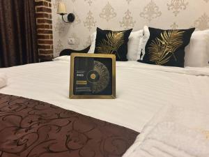a book sitting on top of a bed at Casa Alex Rasnov in Râşnov