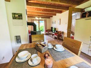 a dining room with a table and a stove at Holiday Home Chalet Chiemsee by Interhome in Sachrang