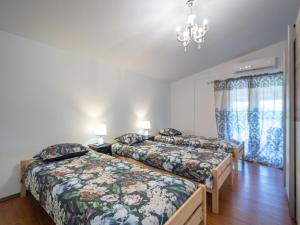 Postel nebo postele na pokoji v ubytování Holiday Home Aleksandra by Interhome