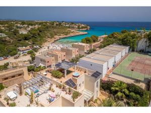 an aerial view of a resort next to the ocean at Apartment Penthouse Las Palmeras by Interhome in Cala Romantica