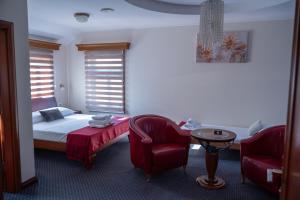 Postel nebo postele na pokoji v ubytování Comfort Lodge + 33 fotografií