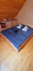 Łóżko lub łóżka w pokoju w obiekcie Góralska Chata & Spa