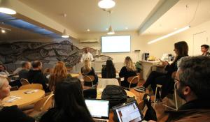 a group of people sitting in a room with a presentation at WOT Lagos Montemar in Lagos