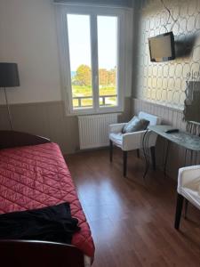 Postel nebo postele na pokoji v ubytování Hôtel de la Pointe de Mousterlin