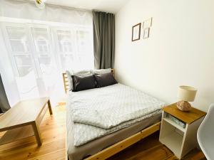 Ένα ή περισσότερα κρεβάτια σε δωμάτιο στο MagMar Studio Kluczbork