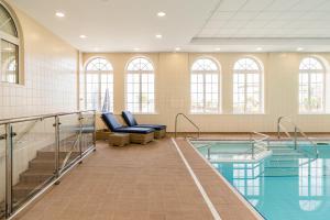 a swimming pool in a building with a swimming pool at The Palace Hotel in Paignton