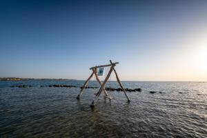 a wooden stand in the water on the beach at Labranda Club Makadi in Hurghada