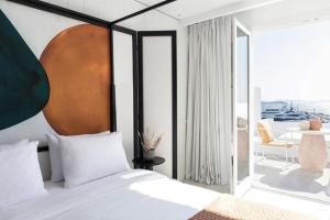 Cama ou camas em um quarto em Porto Mykonos