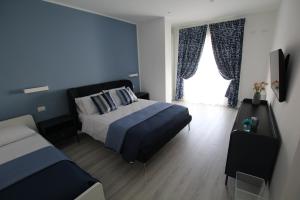 Postel nebo postele na pokoji v ubytování Villa Capodacqua