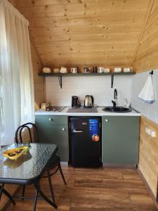Kuchyň nebo kuchyňský kout v ubytování Cottage Liantto