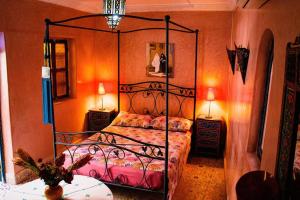 a bedroom with a metal bed in a room at Riad - In Medina - Kesh Design in Marrakesh
