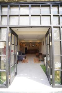 an open door of a house with a living room at Green orchard skardu in Skardu