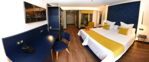 Postel nebo postele na pokoji v ubytování Design Plus Bex Hotel