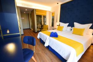Postel nebo postele na pokoji v ubytování Design Plus Bex Hotel