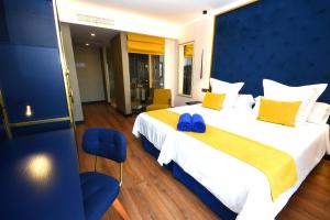 Postel nebo postele na pokoji v ubytování Design Plus Bex Hotel