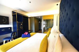 Postel nebo postele na pokoji v ubytování Design Plus Bex Hotel