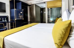 Postel nebo postele na pokoji v ubytování Design Plus Bex Hotel