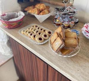 a counter top with bread and pastries on it at SAN LEONARDO in Cariati