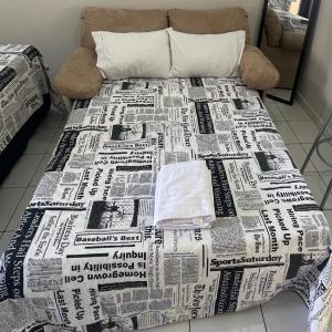 Katil atau katil-katil dalam bilik di The Belluno apartamento completo e aconchegante