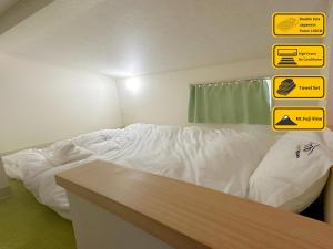 Letto o letti in una camera di Necoana Glamping富士山景BBQトレーラーヴィラ