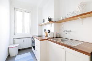 Kuchyňa alebo kuchynka v ubytovaní Operastreet City Center Apartment Algarve