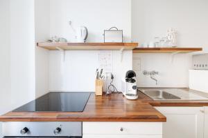 Kuchyňa alebo kuchynka v ubytovaní Operastreet City Center Apartment Algarve