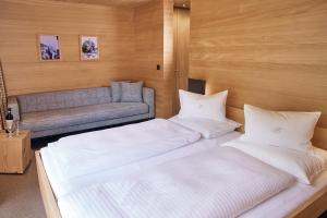 Łóżko lub łóżka w pokoju w obiekcie abitare chalets