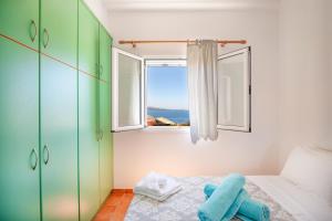 Ένα ή περισσότερα κρεβάτια σε δωμάτιο στο Takis House