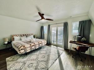 a bedroom with a bed and a ceiling fan at Aspen Alcove - Amazing Views Private Hot Tub in Park City