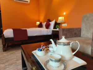Voodi või voodid majutusasutuse Sajjan Bagh Resort toas