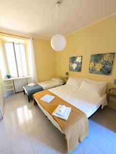 a bedroom with a large bed and a table at La tua finestra su Varenna-Como- in Fiumelatte