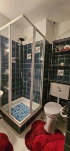 a bathroom with a shower and a toilet at Apartment 3 115 in Goslar