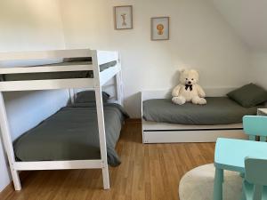 Postel nebo postele na pokoji v ubytování Au bord de la mer
