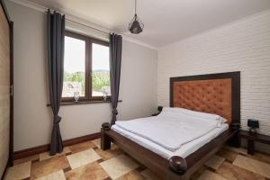 Katil atau katil-katil dalam bilik di Apartamenty EverySky Gasthaus Karpacz