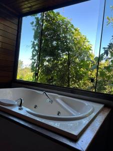 ภาพในคลังภาพของ Encanto da Mata - Chalé Embaúba - Lavras Novas MG ในลาวรัสโนวัส