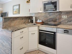 Kuchyň nebo kuchyňský kout v ubytování Enen Neest App 2 + 18 fotografií