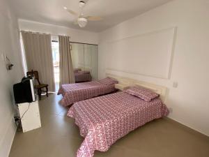 Katil atau katil-katil dalam bilik di Casa No Guarujá +9 gambar
