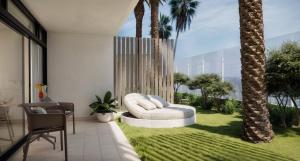a living room with a white couch and palm trees at Don Gregory by Dunas - Adults Only in San Agustin