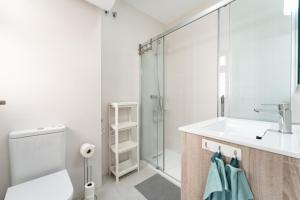 a bathroom with a toilet and a sink and a shower at CT 288 AL - Faro's Retamar Cuddly Nest for 2 in Almería