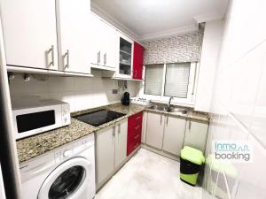 A kitchen or kitchenette at InmoBooking LeriMar