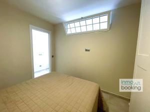 A bed or beds in a room at InmoBooking LeriMar