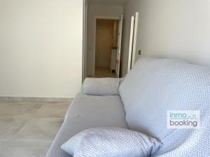 A bed or beds in a room at InmoBooking LeriMar