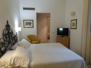 Кровать или кровати в номере Hotel Minerva
