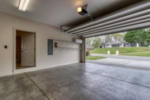 an empty garage with an open door to a driveway at Love View in Sevierville +42 photos
