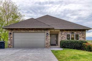 a house with a garage in front of it at Love View in Sevierville