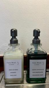 two bottles of soap sitting next to each other at Casa Moni con Vistas al Mar in Playa de Santiago