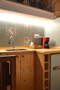 a kitchen with a sink and a counter top at Casa Philos in Ceglie Messapica