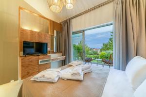 Postel nebo postele na pokoji v ubytování Pelagus Luxury Villas
